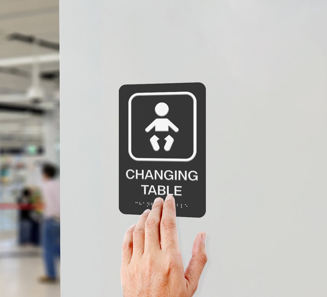 Baby Wearing Diaper Braille Sign
